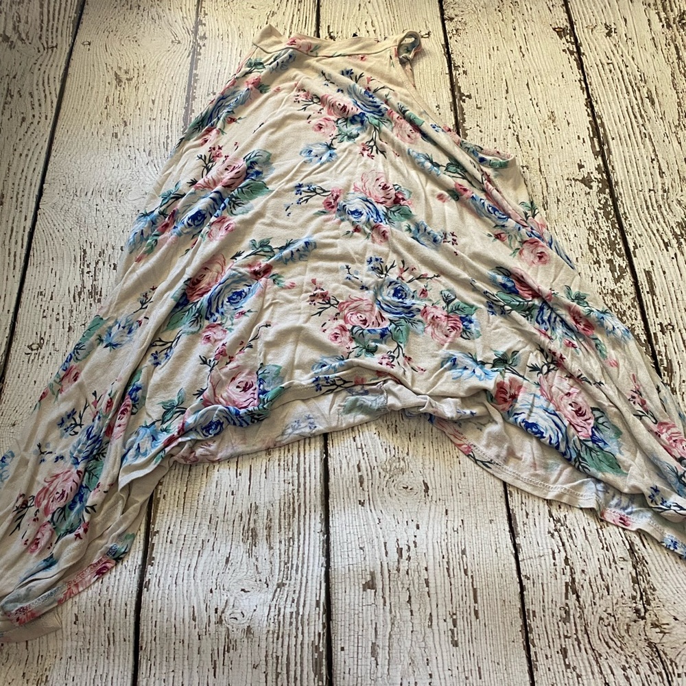 really cute blouse. the sides drape down longer than the front or back